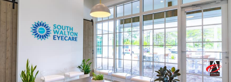 Eye clinic waiting room with big windows, door, and seats