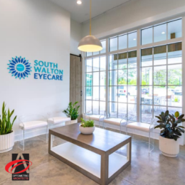 Eye clinic waiting room with big windows, door, and seats