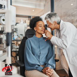 Eye doctor looking closely and providing patient with an eye exam